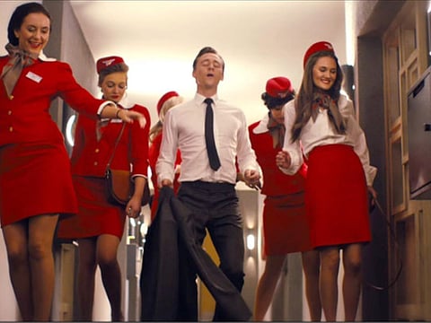 Tom Hiddleston dances through a retro hellscape in the trailer for ‘High-Rise’