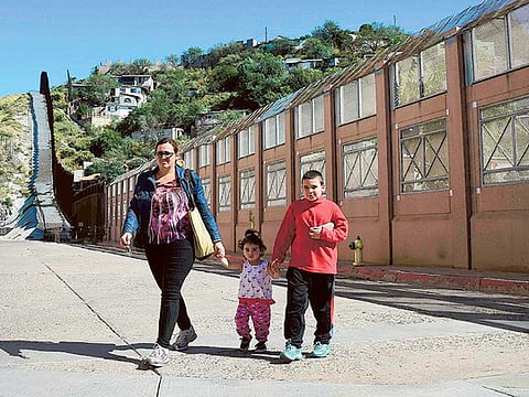 A woman and two children in Nogales, Arizona. The town is made up of some 21,000 mainly Hispanic speaking residents