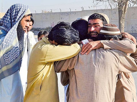 File picture: Family members of attack victims mourn outside the Balochistan Police College.