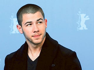 Watch: Nick Jonas falls through hole on stage