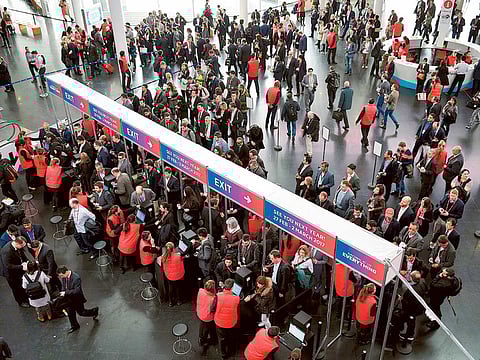 Visitors arrive at the 2016 Mobile World Congress in Barcelona, on February 22, 2016.