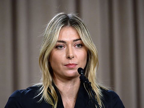 Sharapova may sue after drug ban reduced to 15 months