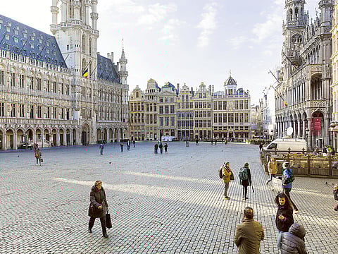 Tourists at the almost empty Grand Place in Brussels. Right now, travelling in the EU’s 27 nations is a trial for tourists and airlines alike.