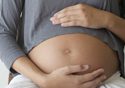 A pregnant woman. For illustrative purposes.