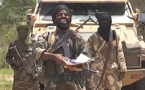 A screengrab taken on July 13, 2014 from a video released by extremist group Boko Haram and obtained by AFP shows the leader of the Nigerian Islamist extremist group Boko Haram, Abubakar Shekau (C). 
