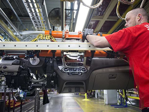 An employee on the production line at the General Motors assembly plant in Arlington, Texas. The overall US payroll employment was ratcheted down by more than 400,000 jobs because of an annual “benchmark revision” 