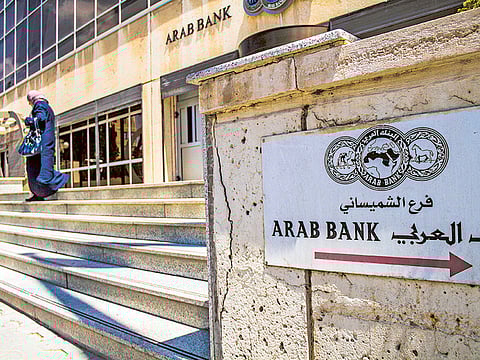 The headquarters of Arab Bank PLC in the financial district in Amman, Jordan. The bank reported on  a 66% year-on-year drop in first-half net profit to $152.1 million.