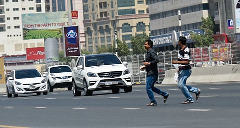 Al Ittihad road near Ansar Mall. There is a Dh200 fine for jaywalking, but some people don’t seem to
care.