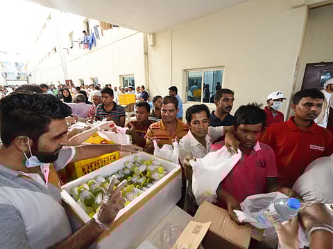 Dubai Volunteering Center with other social groups distribute meals to workers  in DIP as part of their Honour Labour campaign, organized by the Community Development Authority. Picture for illustrative purpose only.