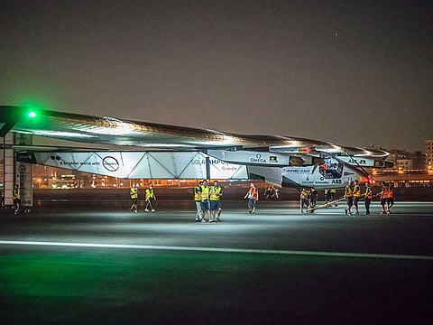 Technicians preparing the Solar Impulse 2, the solar powered plane, at Cairo's International Airport in Egypt before it takes off and heads to Abu Dhabi on the final leg of its world tour with Swiss Bertrand Piccard behind the controls.