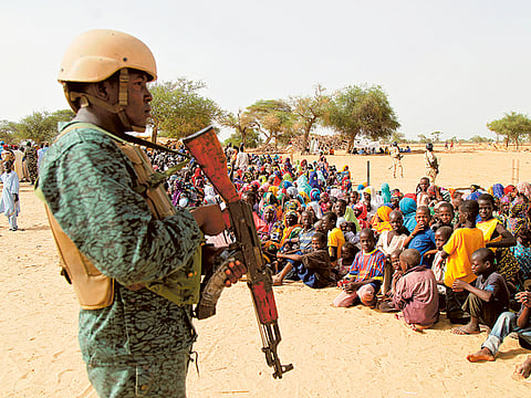 A Niger soldier stands guard at the Boudouri site for displaced persons outside the town of Diffa. 

