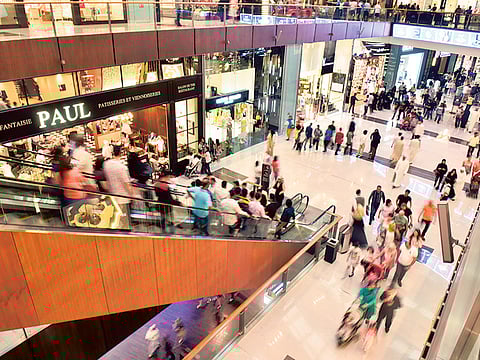 Shoppers at Dubai Mall. Retail sales in the UAE are expected to rebound and grow by 13 per cent to reach $58 billion by the end of 2021 Dubai Chamber of Commerce and Industry.