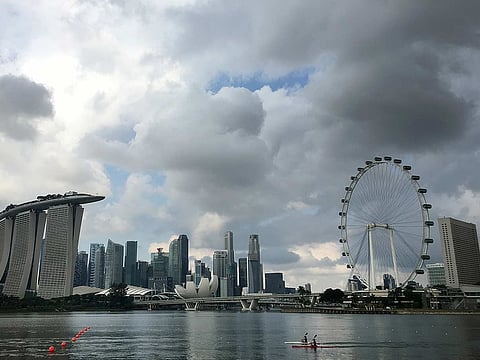 Singapore Flyer, the city-state's observation wheel [R], in Singapore