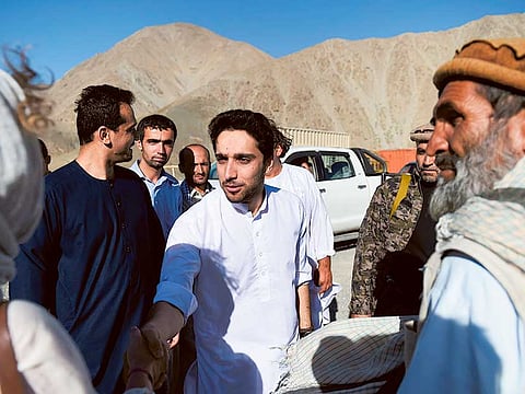 File picture shows Ahmed Massoud with supporters at the tomb of his late father at Saricha in Panjshir province.