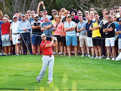 Crowds watch Jon Rahm of Spain in action at the DP World Tour Championship.