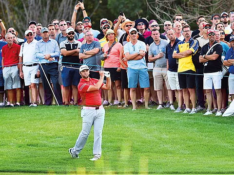 Crowds watch Jon Rahm of Spain in action at the DP World Tour Championship.