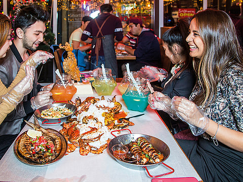 Communal dining is best done at a Filipino 'boodle fight' such as that at Dampa restaurant  in Deira. Grilled or steamed seafood is dumped on a shared table with piles of rice, corn and sauce for group diners to dig into.