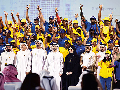 File picture of the 2019 edition of the award ceremony in Dubai. Sheikh Mansour bin Mohammed bin Rashid Al Maktoum (fourth from left) and senior officials seen here with workers during the awards ceremony.