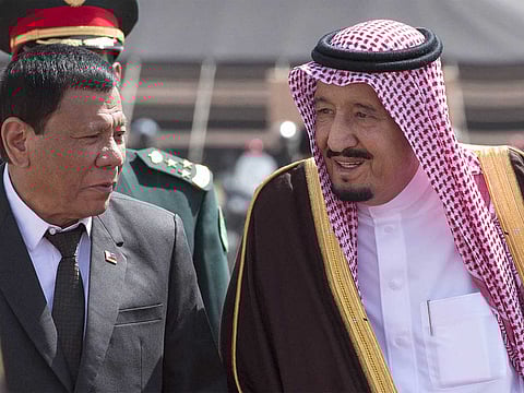 Saudi Arabia's King Salman and Philippine President Rodrigo Duterte review the honour guards upon the latter's arrival in the capital Riyadh in this file picture from 2019..