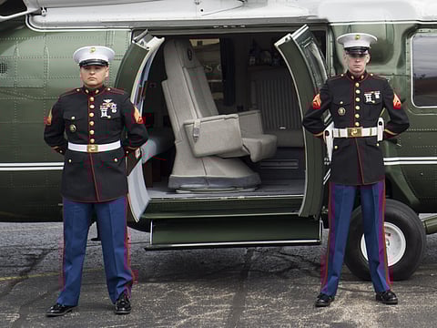 US Marines stand guard outside Marine One as they wait for US President Donald Trump