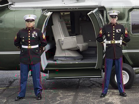 US Marines stand guard outside Marine One as they wait for US President Donald Trump