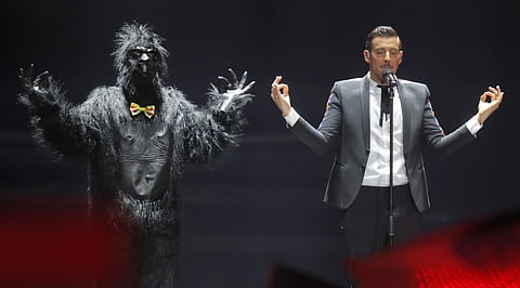 Francesco Gabbani from Italy, right, performs the song ""Occidentali's Karma" during the Final for the Eurovision Song Contest, in Kiev, Ukraine, Saturday, May 13, 2017. 