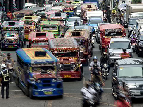 Jeepneys are seen as a traffic enforcer manages a busy street in Manila. Dubbed 'jeepneys' and once hailed as the 'King of the Road' they are a cultural symbol in the Philippines to rival New York's yellow taxis - and for decades they provided cheap and regular transport for millions. The spike in diesel prices due to the Middle East conflict has seen jeepney fees rise.