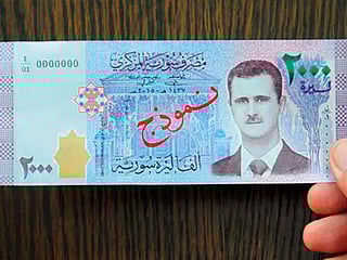 Syrian pound drops at unprecedented rate. Is Lebanon’s financial crisis to blame?