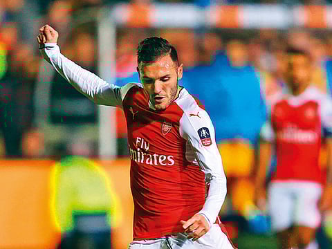 Arsenal’s Lucas Perez rages as he loses his shirt