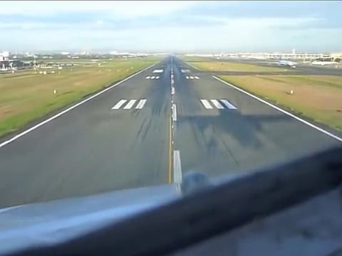 A pilot's view of the runway shortly before touchdown.