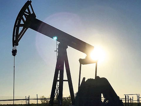 An oil rig drilling a well at sunrise, owned by Parsley Energy Inc. near Midland, Texas. Parsley Energy said it's turning oil wells back on just weeks after shutting them off, illustrating the shale industry's agility in responding to rising crude prices.