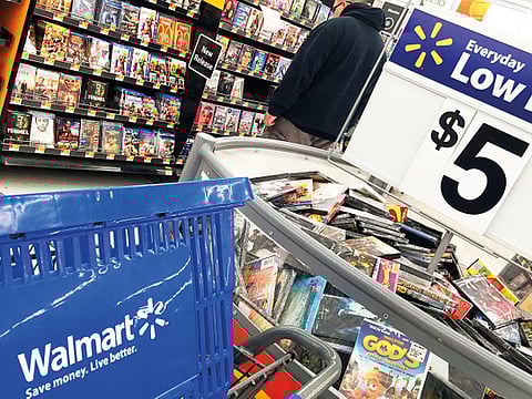 A shopper looks at merchandise at a Walmart in Salem, N.H. 