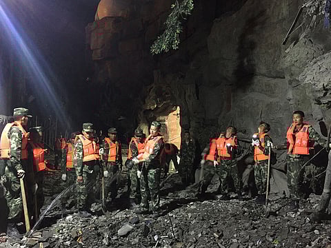 File photo: Chinese paramilitary police search for survivors after an earthquake in Jiuzhaigou in southwest China's Sichuan province early on August 9, 2017.