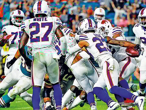 Miami Dolphins wide receiver Jarvis Landry (centre) reaches into the end zone for a touchdown against the Buffalo Bills during the second half at Hard Rock Stadium.