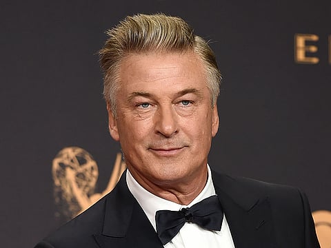 In this Sept. 17, 2017 file photo, Alec Baldwin poses in the press room with the award for outstanding supporting actor in a comedy series for "Saturday Night Live" at the 69th Primetime Emmy Awards in Los Angeles.