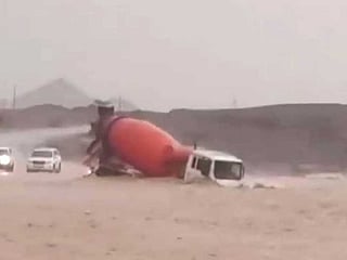 Body of driver swept away by flash floods found