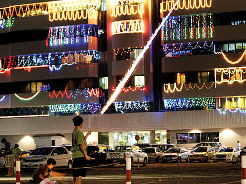 Children enjoy seeing the buildings adorned with coulourful lights to celebrate Diwali
