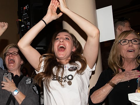 Women cheer as they watch election results at the Democrat Election Night 