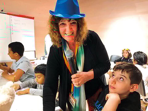 Dee White during a storytelling workshop for children at the Sharjah International Book Fair.