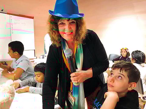 Dee White during a storytelling workshop for children at the Sharjah International Book Fair.