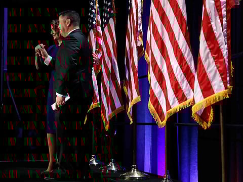 House Democratic Leader Nancy Pelosi of Calif., left, gestures with DCCC Chair Ben Ray Luján, as she arrives to speak to a crowd of volunteers and supporters of the Democratic party at an election night event at the Hyatt Regency Hotel, on Tuesday, Nov. 6, 2018, in Washington. 