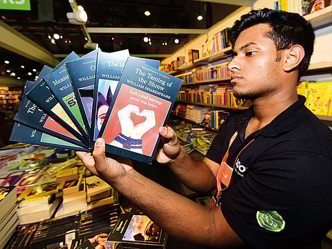 Salesman Sangeeth Sajilal with copies of William Shakespeare’s classic at the Sharjah book fair.