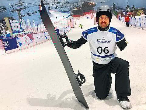 Sean Pollard celebrates after winning the gold in the first World Para Snowboard World Cup at Ski Dubai on Wednesday. 