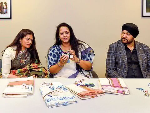 Beema Benazir Anzar and Bindu Nair from Paramparik-The Saree Heritage, and Harmeek Singh, organiser of DWR, with Chendamangalam saris at the Gulf News office.