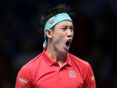 Japan's Kei Nishikori shouts after winning a point during his ATP World Tour Finals singles final tennis match against Switzerland's Roger Federer at the O2 Arena in London, Sunday Nov. 11, 2018.