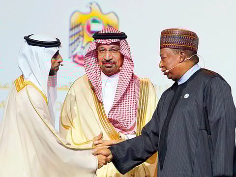Suhail Mohammed Faraj Al Mazroui (left) greets Mohammad Barkindo, Opec secretary-general in the presence of Saudi Arabia’s energy minister Khalid Al Falih during Adipec on Monday.