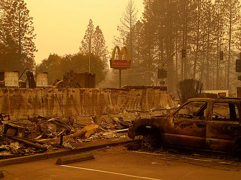 A sign still stands at a McDonald's restaurant burned in the Camp Fire, Monday, Nov. 12, 2018, in the northern California town of Paradise.