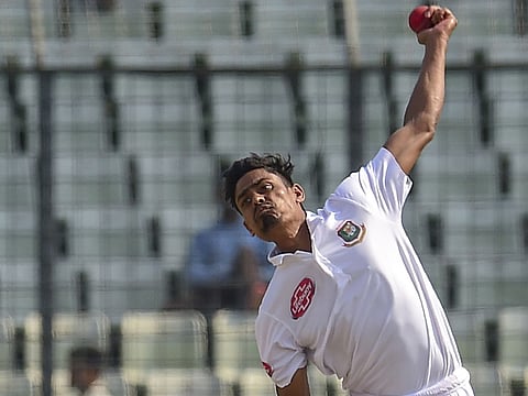 Bangladesh's Taijul Islam delivers a ball during the third day of the second Test cricket match against Zimbabwe at the Sher-e-Bangla National Cricket Stadium  in Dhaka on November 13, 2018. 