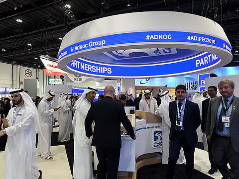 Delegates tour the pavilion of Adnoc on the 2nd day of Adipec 2018 in Abu Dhabi. 