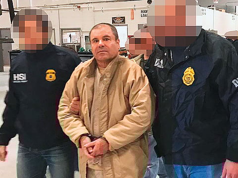 El Chapo is escorted by Mexican police during his extradition to US. 